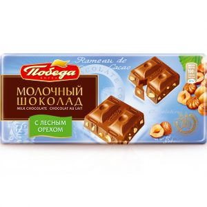 Шоколад молочный с кусочками цельного ореха