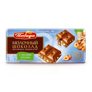 Шоколад молочный с кусочками цельного ореха